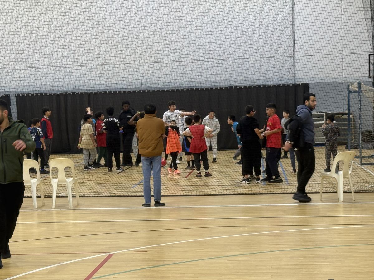 The hall at MYCentre on a soccer night, boys playing across the court