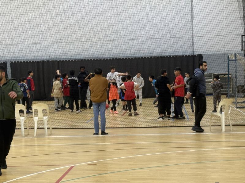 The hall at MYCentre on a soccer night, boys playing across the court